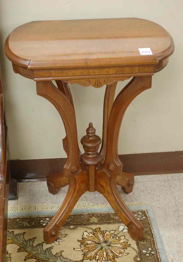 Appraisal: A VICTORIAN WALNUT LAMP STAND American c having an oblong