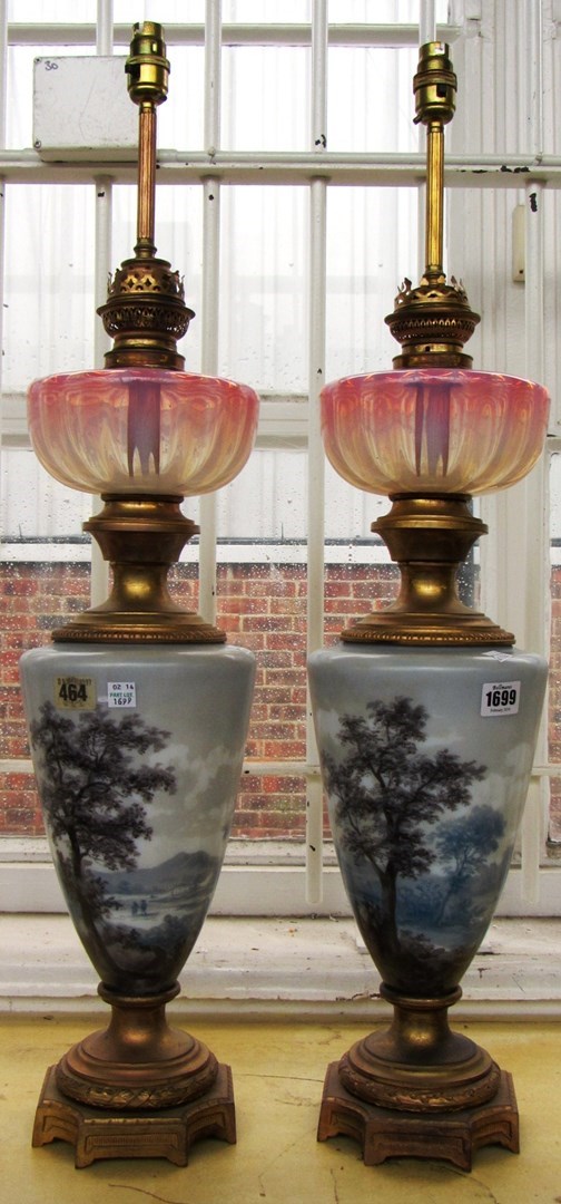 Appraisal: A pair of porcelain and ormolu mounted oil lamp bases