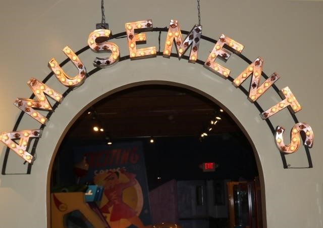 Appraisal: AMUSEMENTS HANGING SIGN FROM THE POPULARTELEVISION SERIES BOARDWALK EMPIRE STARRING