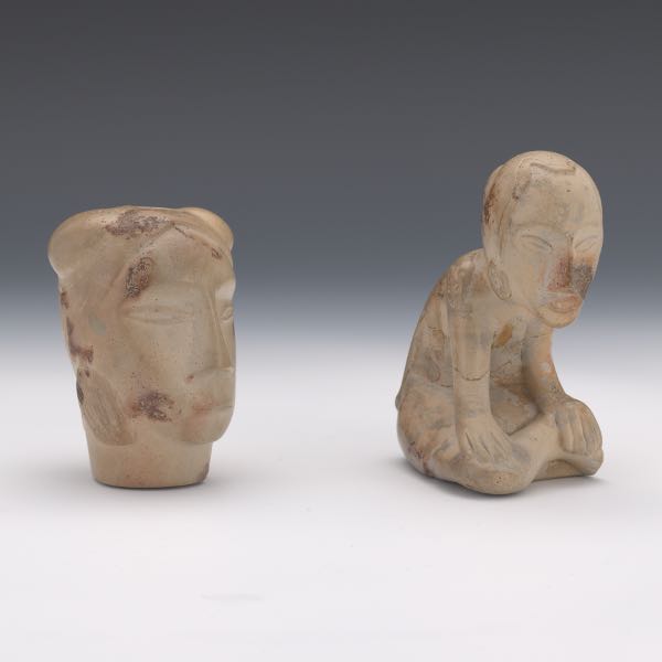 Appraisal: TWO OHIO NATIVE AMERICAN FIGURAL PIPES One seated figure marked