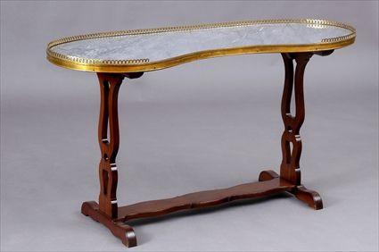 Appraisal: LOUIS XVI GILT-BRONZE MOUNTED MAHOGANY TABLE The kidney-shape grey Ste