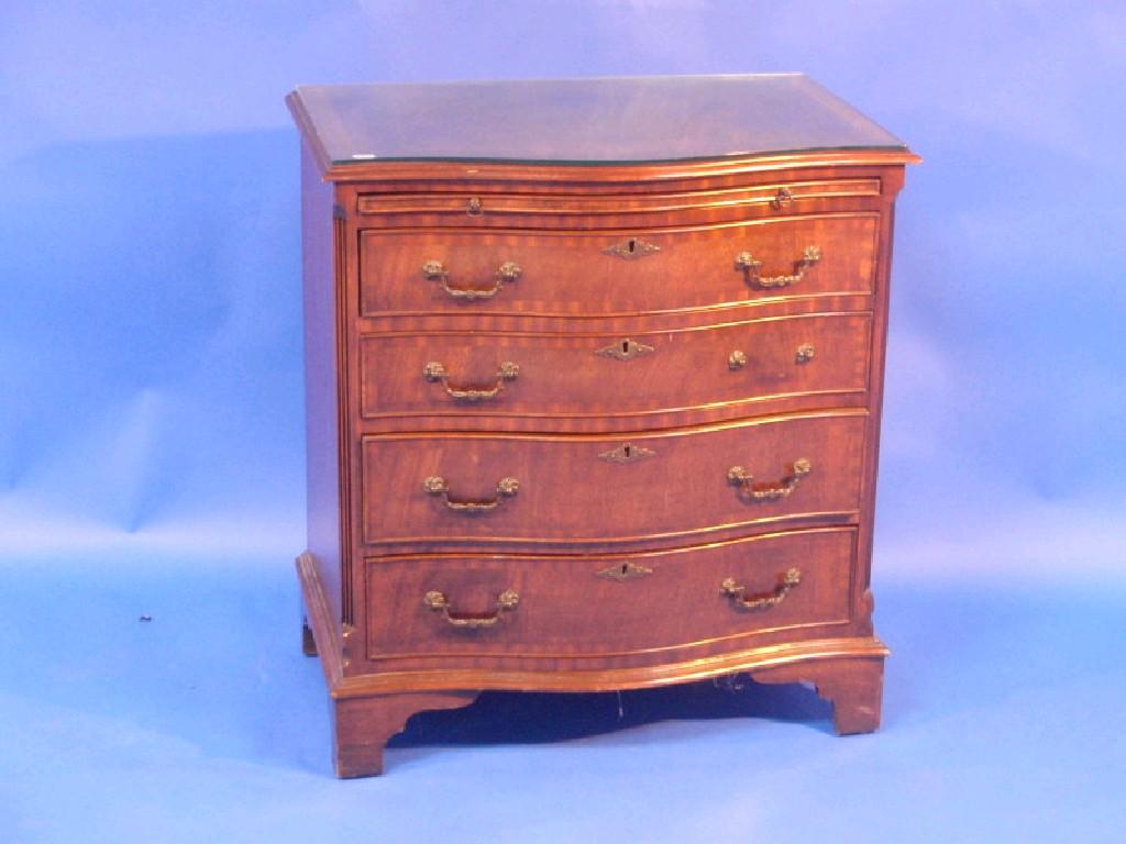 Appraisal: A thC mahogany serpentine chest with a brushing slide four