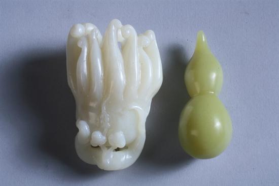 Appraisal: CHINESE WHITE JADE CARVING OF BUDDHA'S HAND Together with green