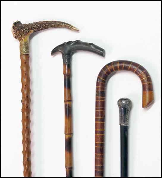 Appraisal: FOUR WALKING STICKS Comprised of one with an antler cane