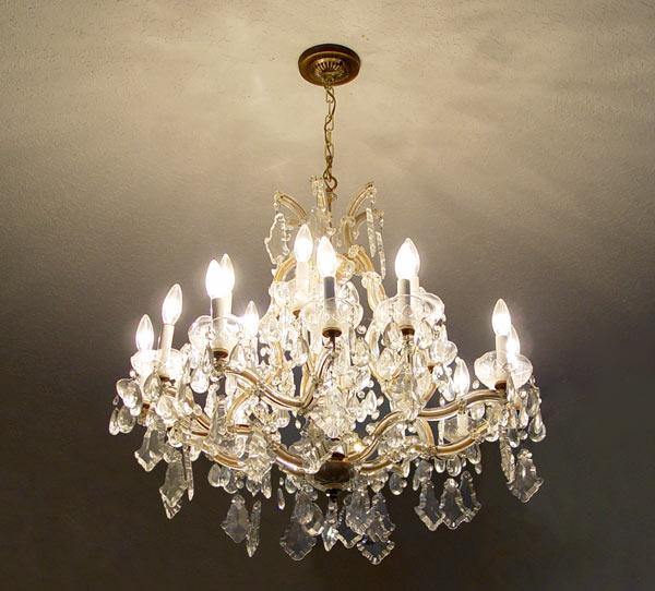 Appraisal: MARIA THERESA CRYSTAL CHANDELIER Six arms branching to three lights