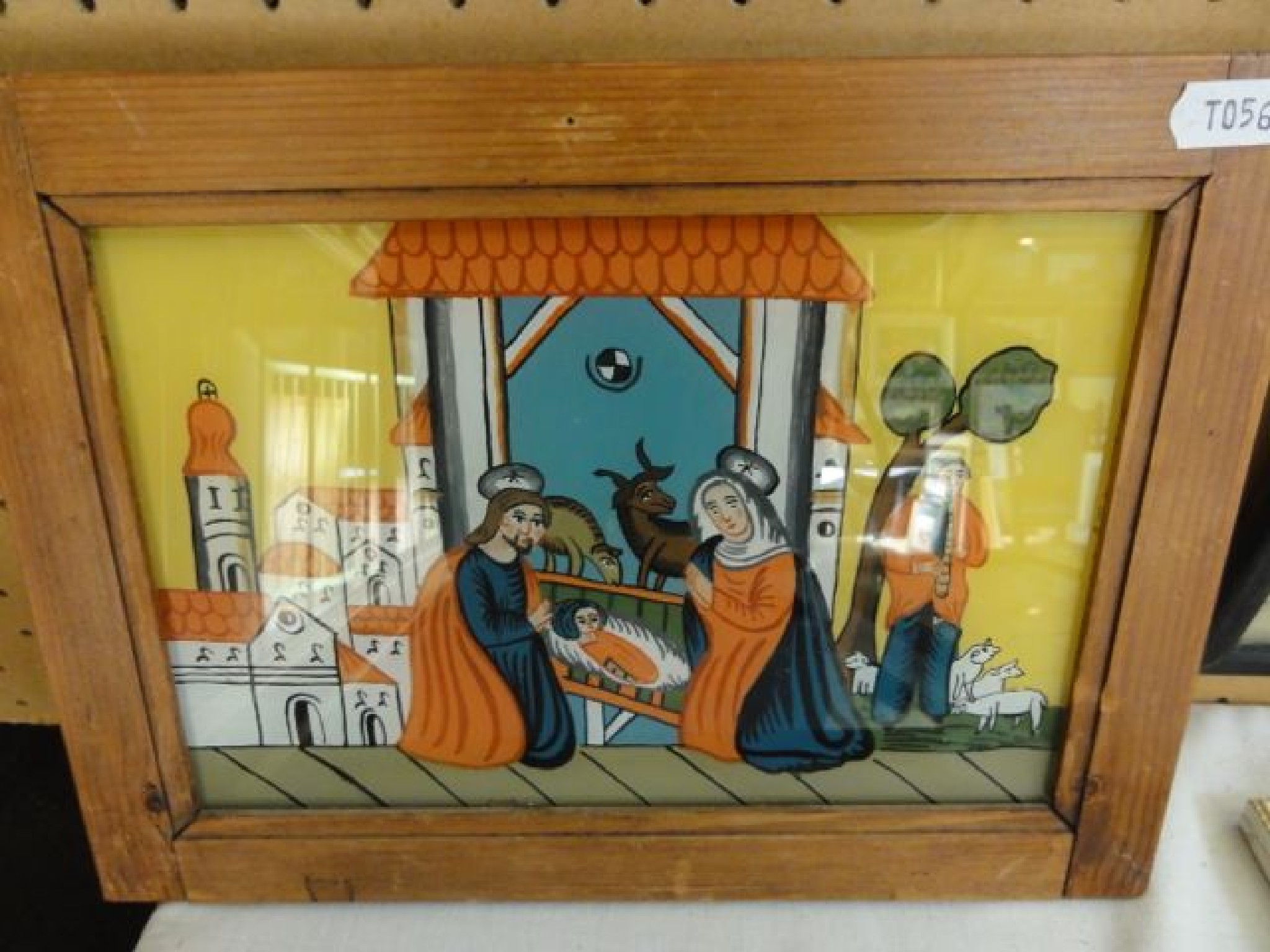 Appraisal: A painting on glass panel of a nativity scene incorporating