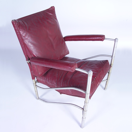 Appraisal: WARREN McARTHUR Lounge chair with original red upholstery on tubular