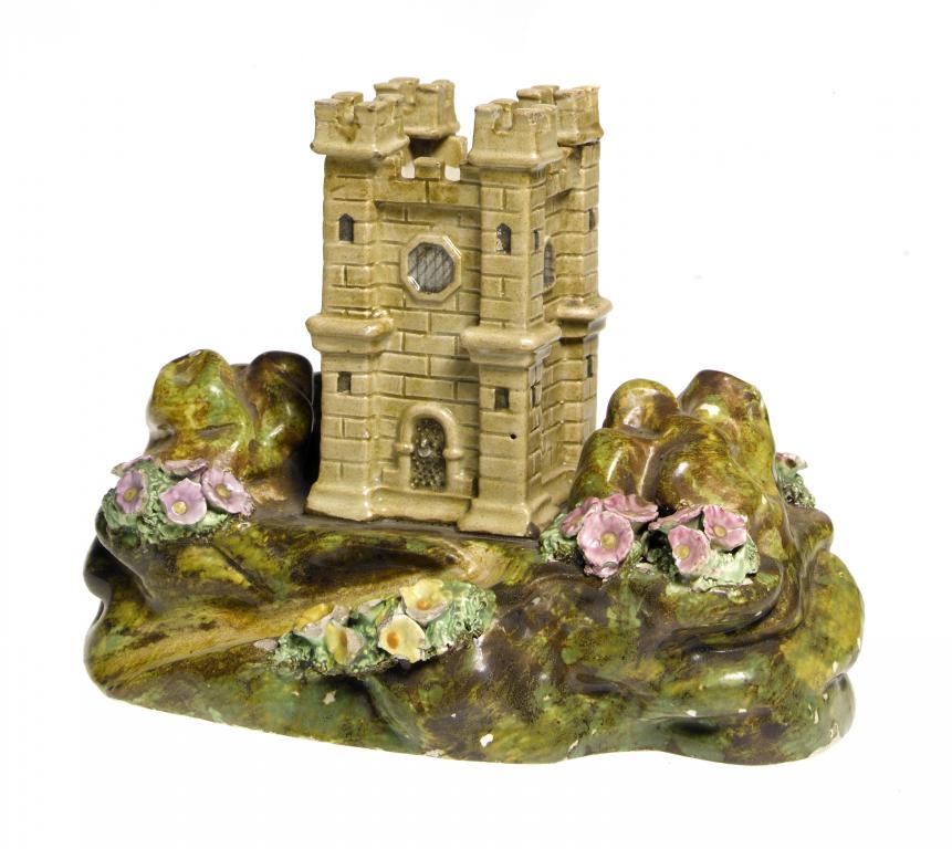 Appraisal: A PEARLWARE SPILL HOLDER in the form of a castle