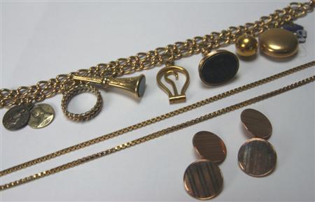 Appraisal: An ct gold charm bracelet composed of two-rows of shaped