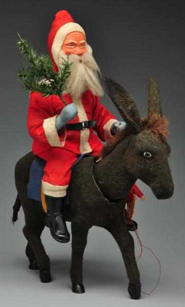 Appraisal: Rare Large Father Christmas Riding Donkey Description Father Christmas riding