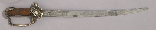 Appraisal: A continental hunting sword th century Slightly curved inch blade