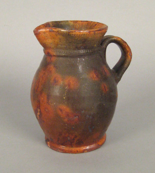 Appraisal: Pennsylvania redware pitcher late th c attributed to Jacob Medinger