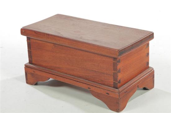 Appraisal: MINIATURE BLANKET CHEST American th century mixed woods Dovetailed case