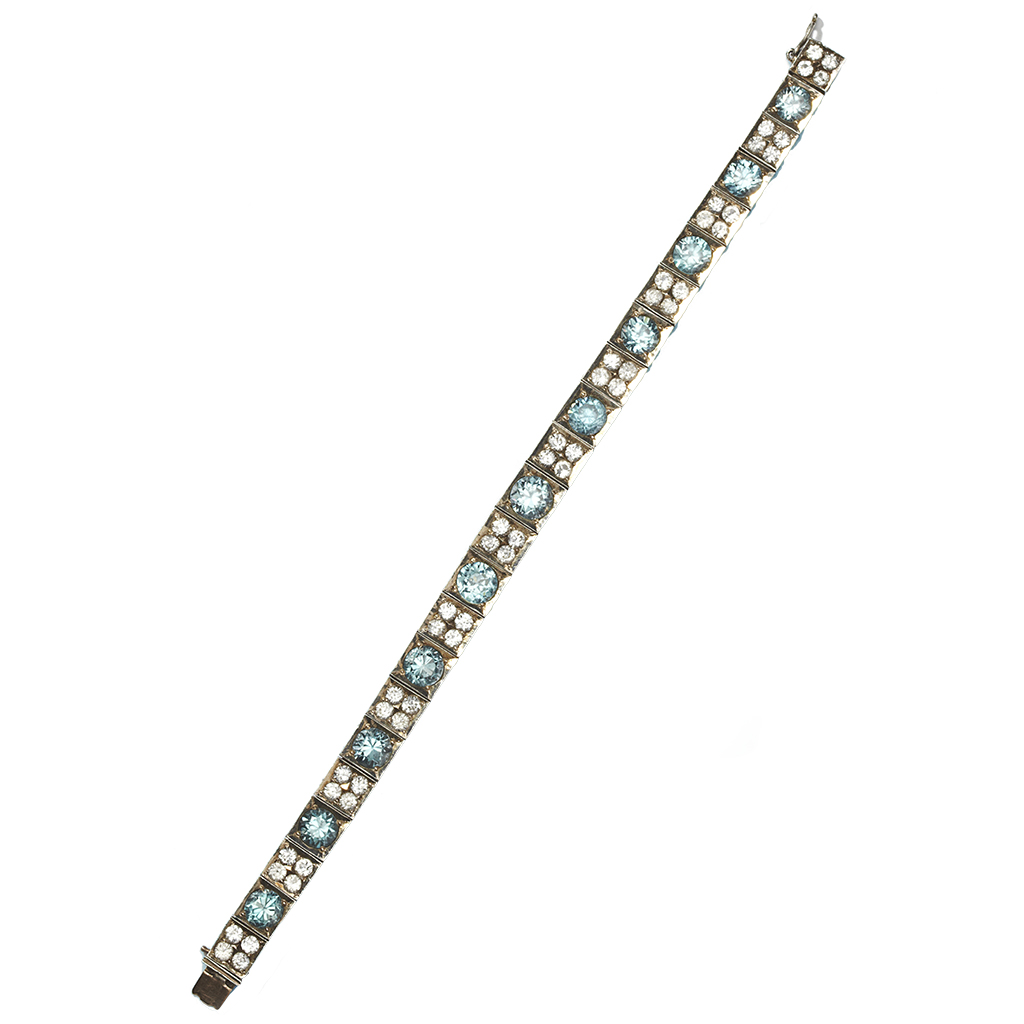 Appraisal: A blue and colourless zircon set bracelet the square links