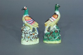 Appraisal: A Staffordshire matched pair of exotic birds mid th century