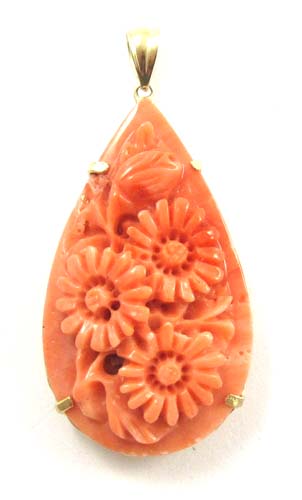 Appraisal: PINK CORAL AND FOURTEEN KARAT GOLD PENDANT the pear shaped