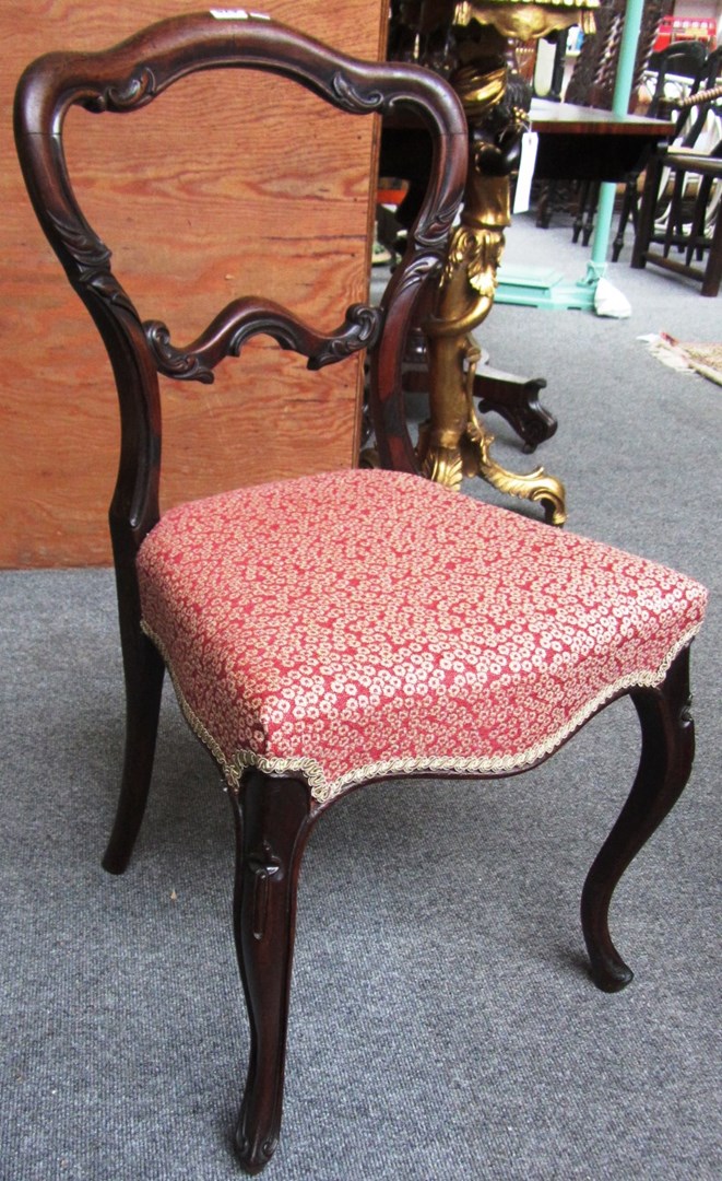 Appraisal: A set of six Victorian rosewood shaped balloon back dining