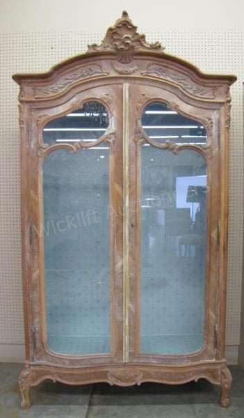 Appraisal: A French Louis XV style armoire with full view glass