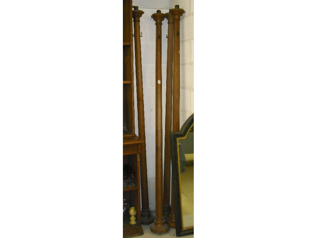 Appraisal: Set of four tall oak octagonal church candlesticks each high