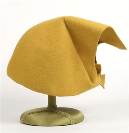 Appraisal: Guy Laroche mustard yellow felt hat s Styled and shaped