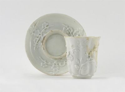 Appraisal: A Chelsea white-glazed beaker and matched trembleuse saucer the beaker