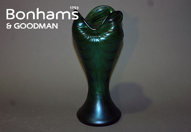 Appraisal: A Loetz style green glass vase with undulate lip and