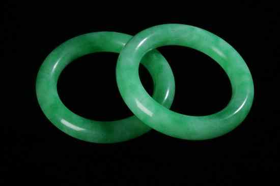 Appraisal: PAIR APPLE GREEN JADEITE BANGLES - in diam