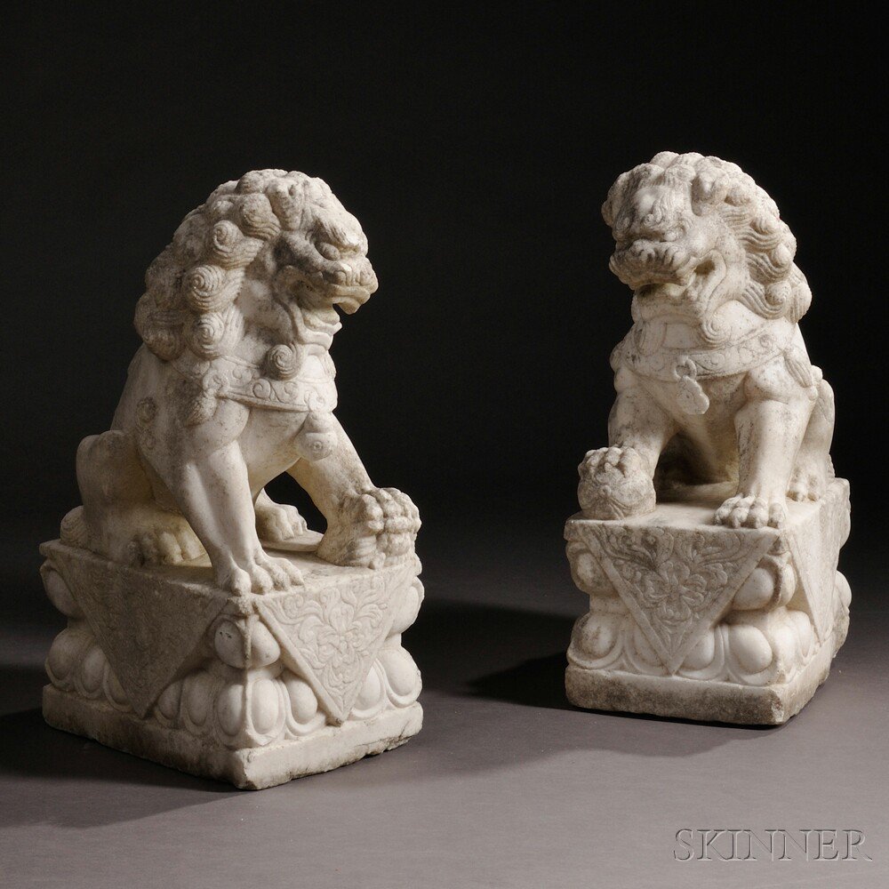 Appraisal: Pair of Buddhist Lions China th th century white marble