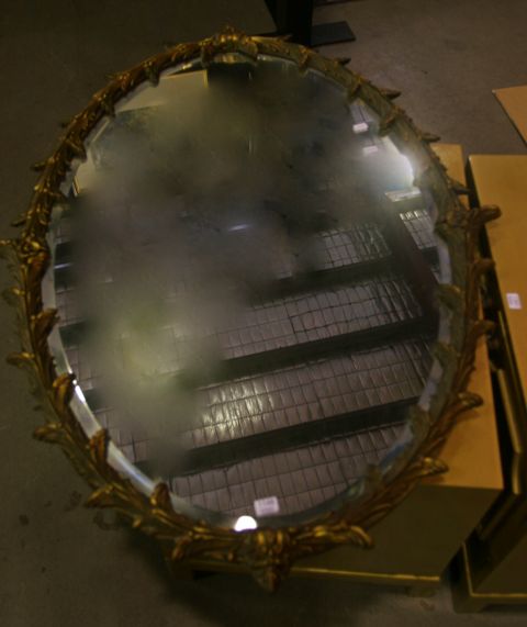 Appraisal: An oval shaped gilt framed mirror cm high cm wide