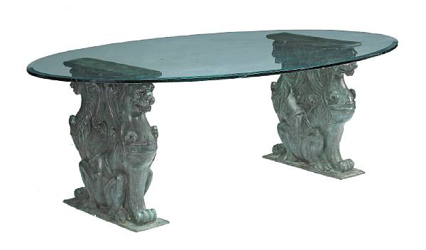 Appraisal: A Neoclassical style patinated bronze and glass oval dining table