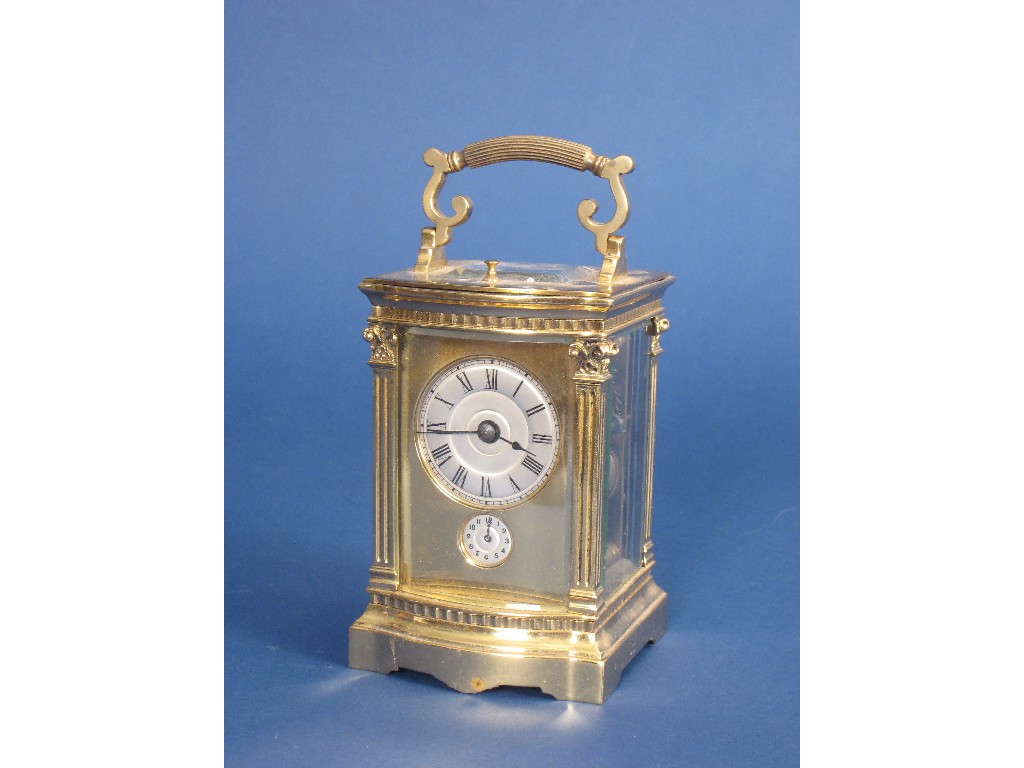 Appraisal: A brass cased French Carriage Clock with circular silvered dial