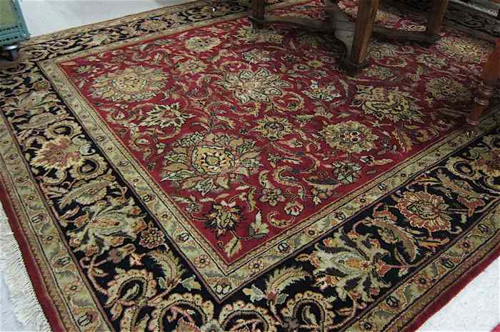 Appraisal: HAND KNOTTED ORIENTAL CARPET Indo-Persian overall floral arabesque decoration on