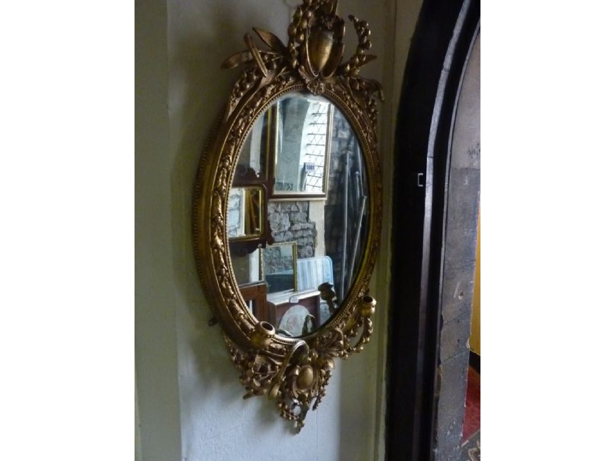 Appraisal: A th century girandole the oval gilt frame with trailing