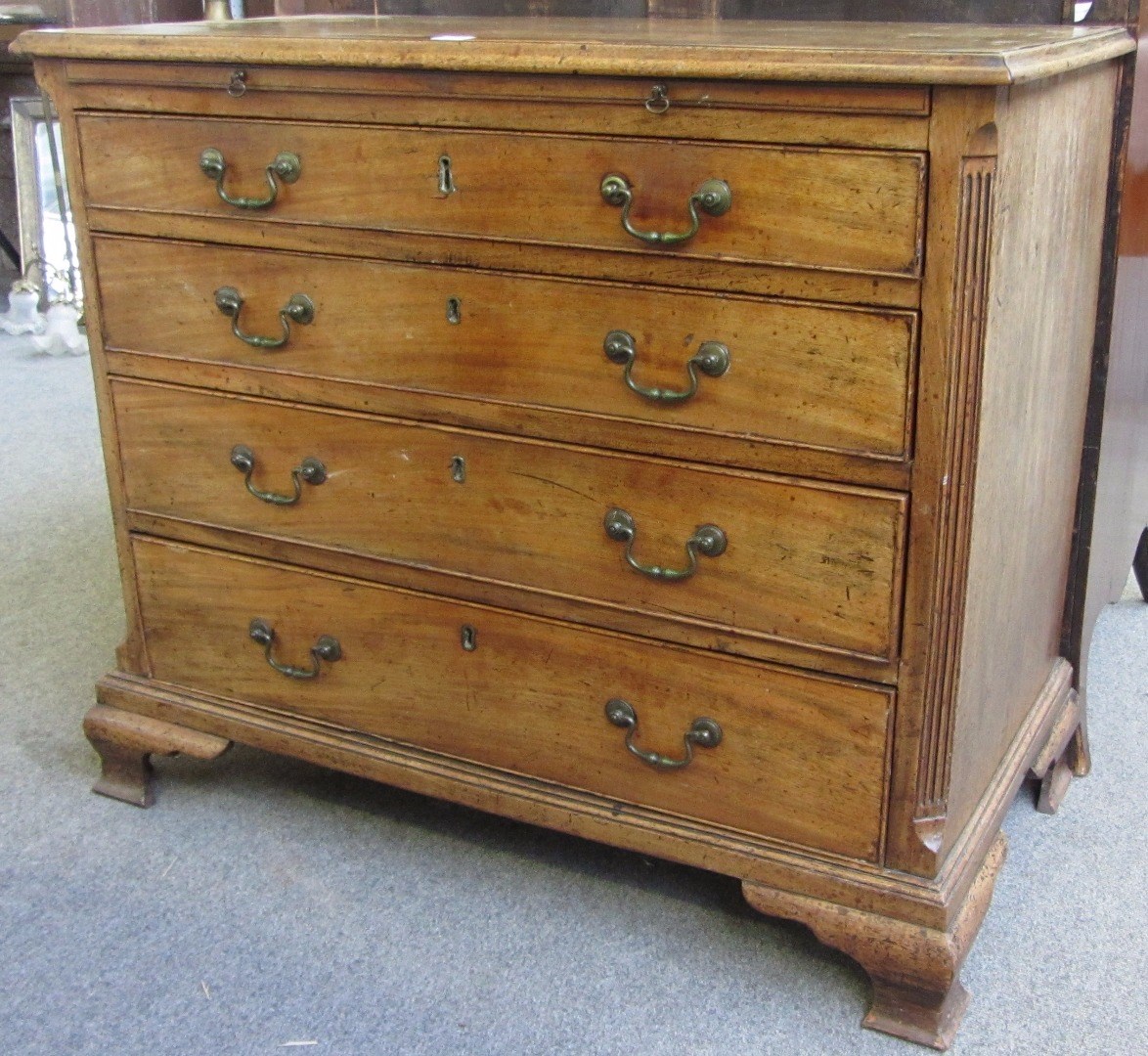 Appraisal: A mid th century mahogany chest the brushing slide over