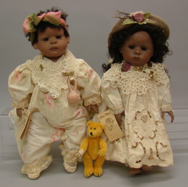 Appraisal: Pair of black porcelain artist proof dolls by Linda Valentino