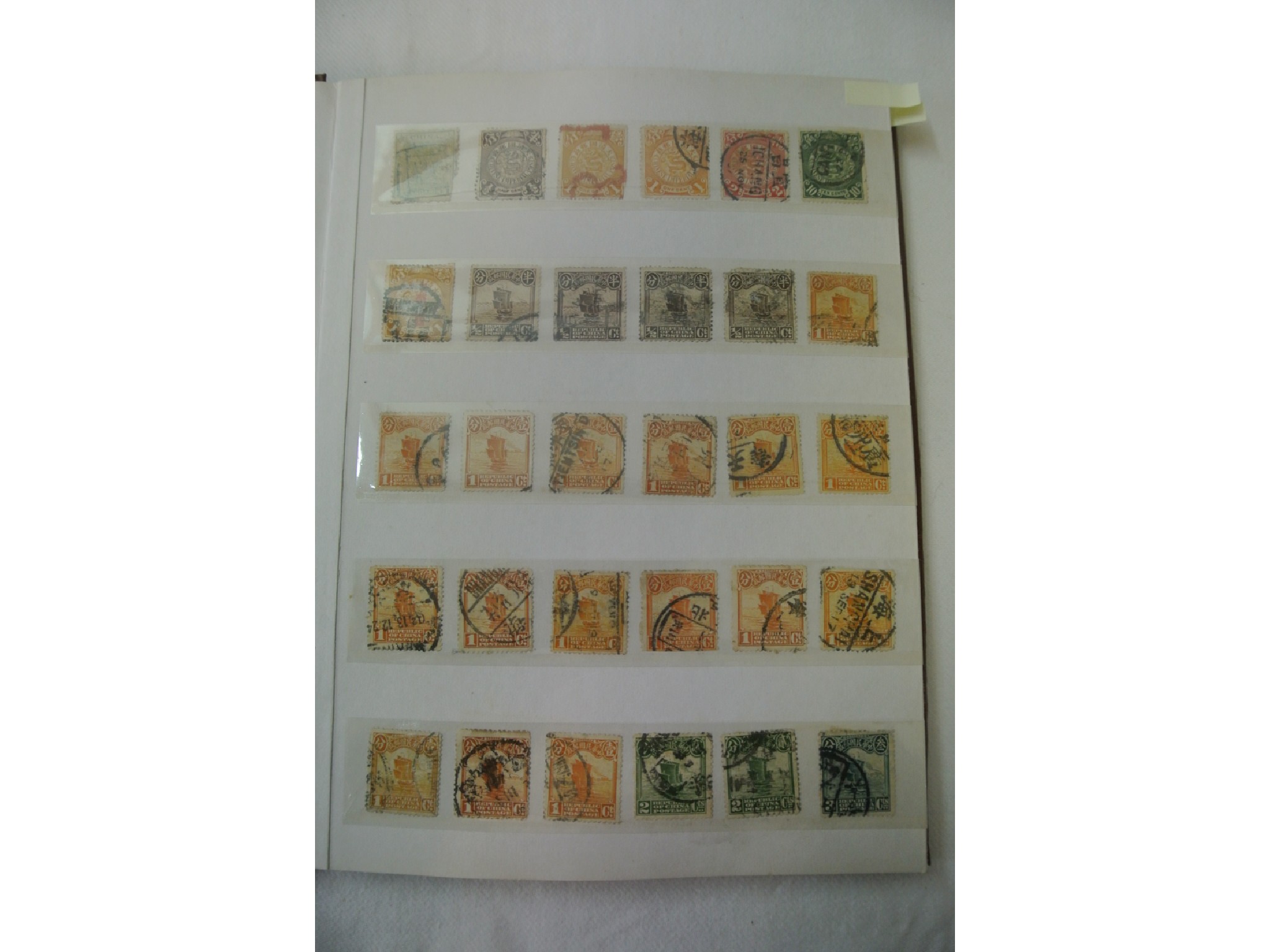 Appraisal: A stock book containing Chinese stamps from early issues Coiling