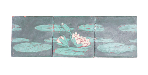 Appraisal: GRUEBY Three-tile frieze decorated in cuenca with ivory waterlilies and