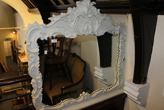 Appraisal: A REPRODUCTION GILT FOLIATE SCROLL SMALL OVERMANTEL MIRROR now white