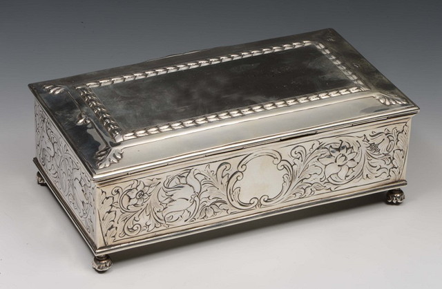 Appraisal: A SILVER CIGARETTE BOX of rectangular form with embossed acanthus