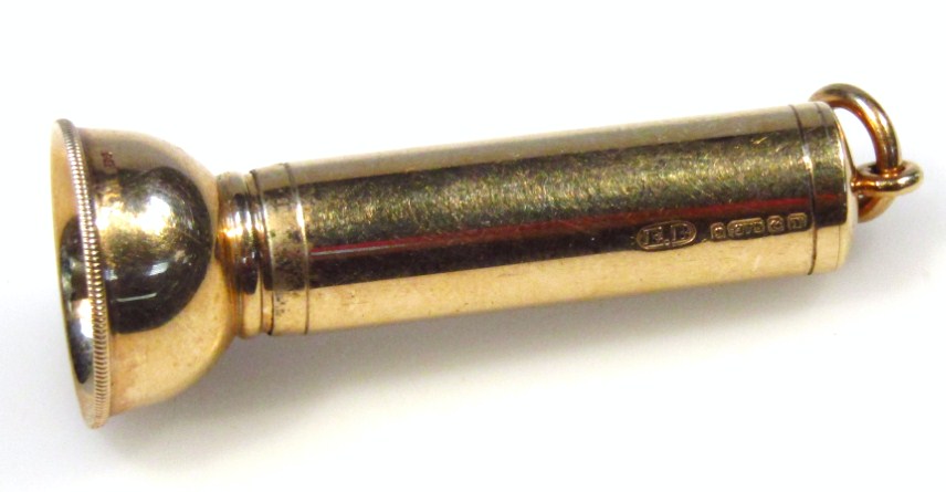 Appraisal: A ct gold cigar piercer of torch outline with ring