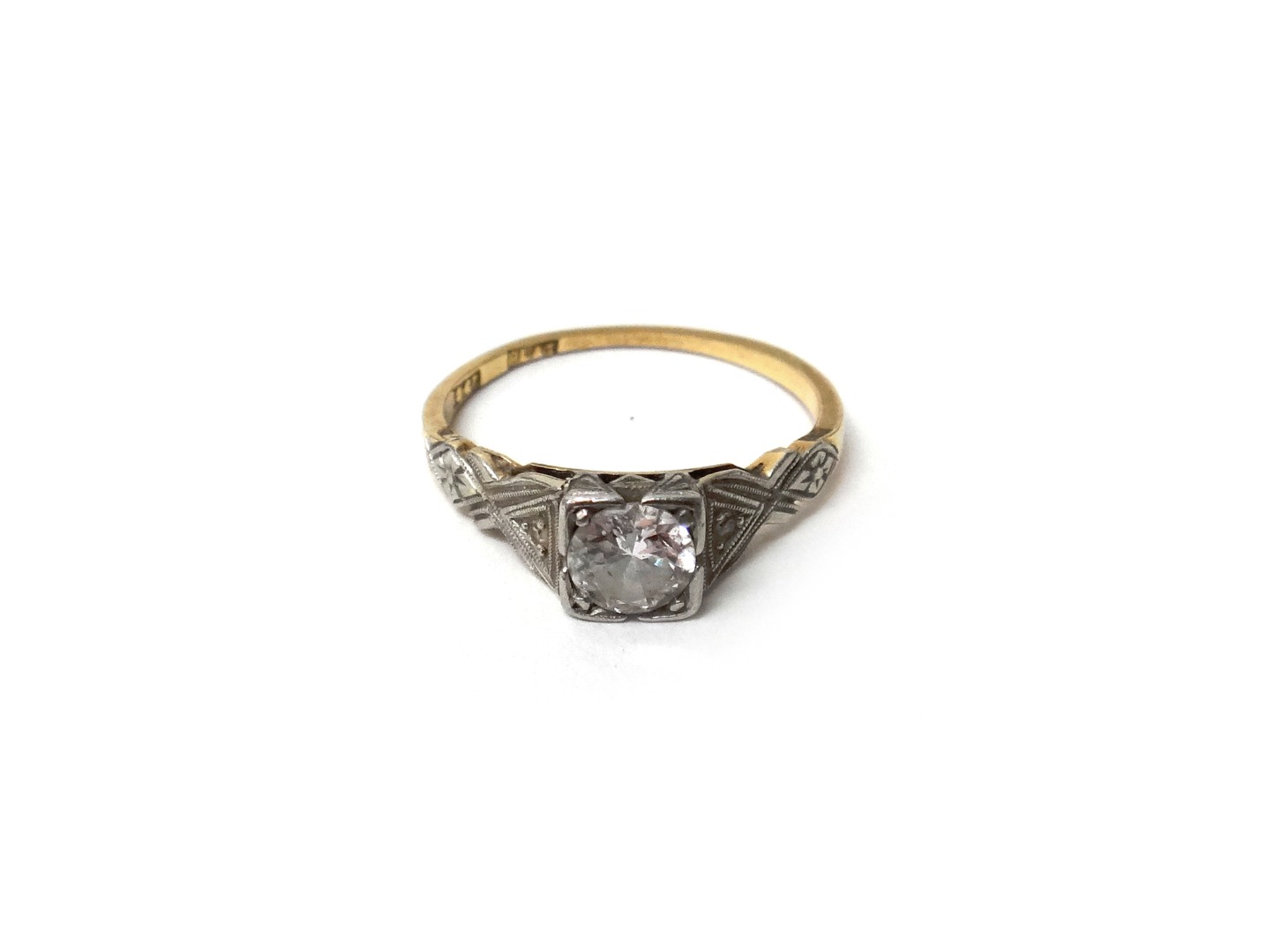 Appraisal: A gold and platinum diamond set ring mounted with the