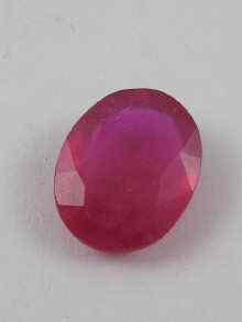 Appraisal: A loose polished oval ruby approx x mm Approx weight