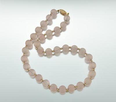 Appraisal: Carved Pink Quartz Bead Necklace k yellow gold filigree clasp