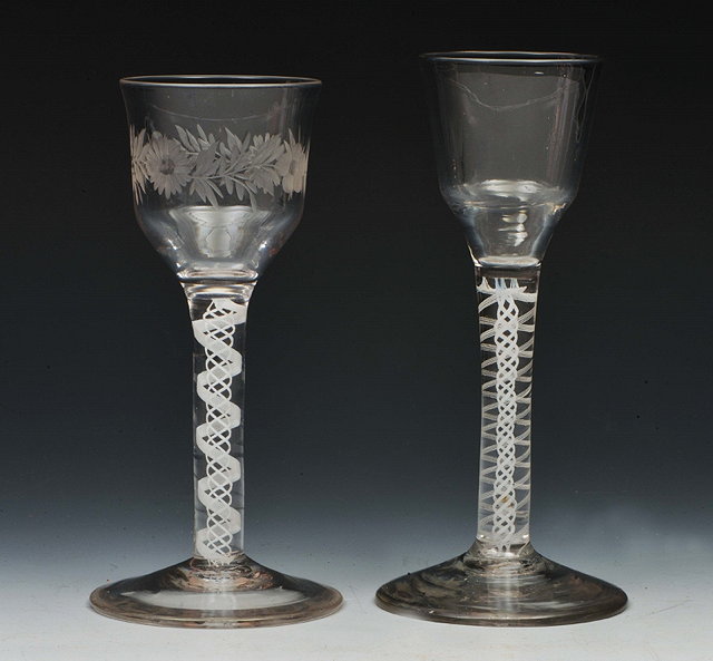 Appraisal: TWO ANTIQUE WINE GLASSES one with engraved bowl and double