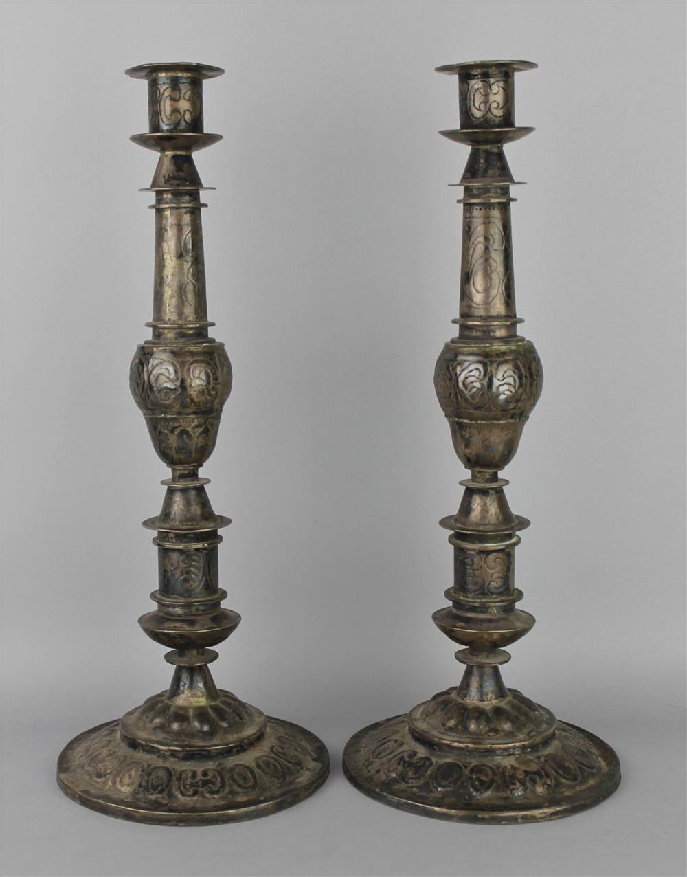 Appraisal: PAIR OF SILVERED METAL SPANISH COLONIAL CANDLESTICKS of shaped columnar