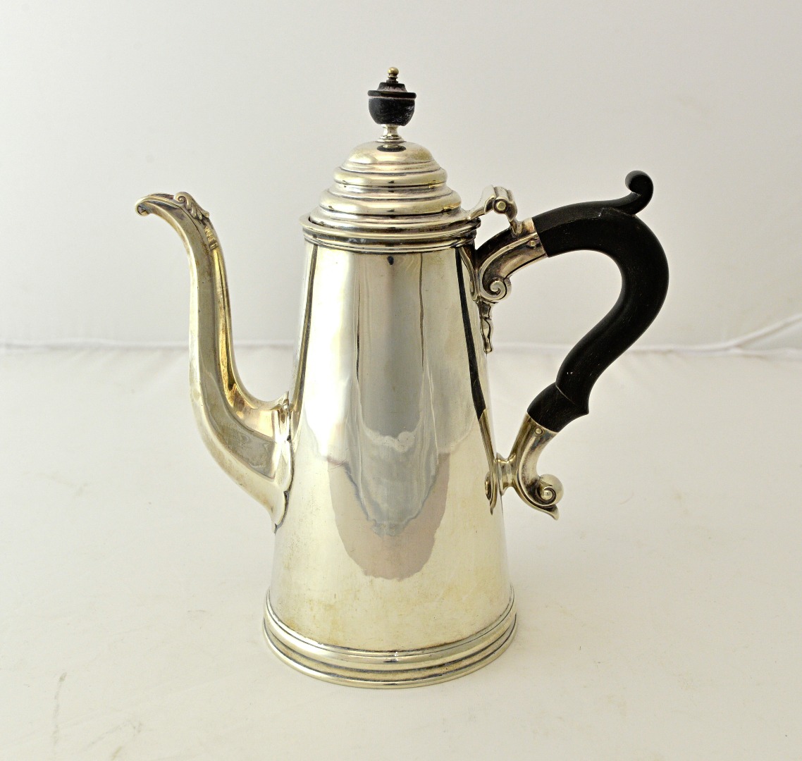 Appraisal: A silver coffee pot of tapering cylindrical form with a