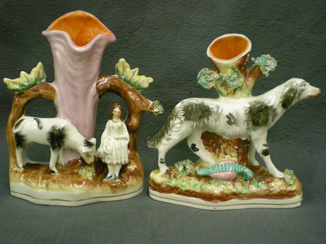 Appraisal: Two Staffordshire figural spills including spill depicting arbor grazing cow