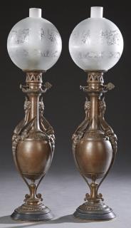 Appraisal: Pair of French Patinated Spelter Oil Lamps c Pair of