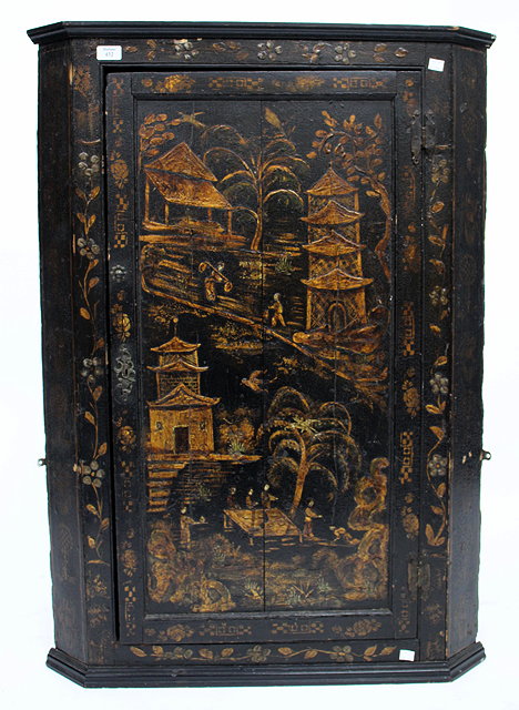 Appraisal: AN TH CENTURY BLACK LACQUERED HANGING CORNER CUPBOARD the panelled