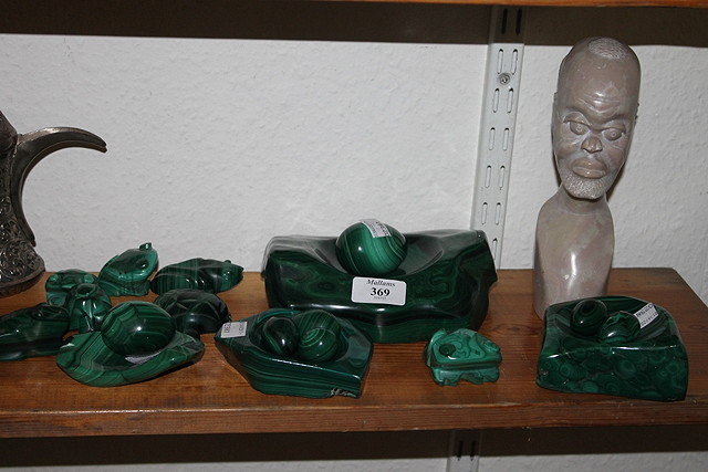 Appraisal: A COLLECTION OF CARVED MALACHITE two ivory boats a bhutan